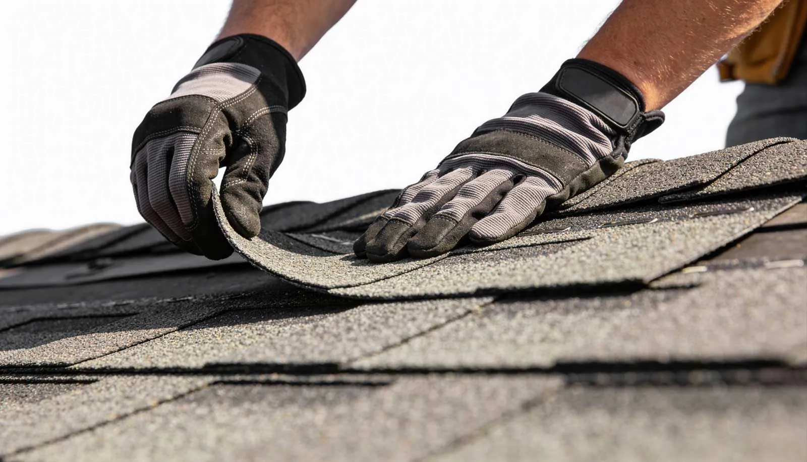 Close detail of layered shingle and metal roofing material
